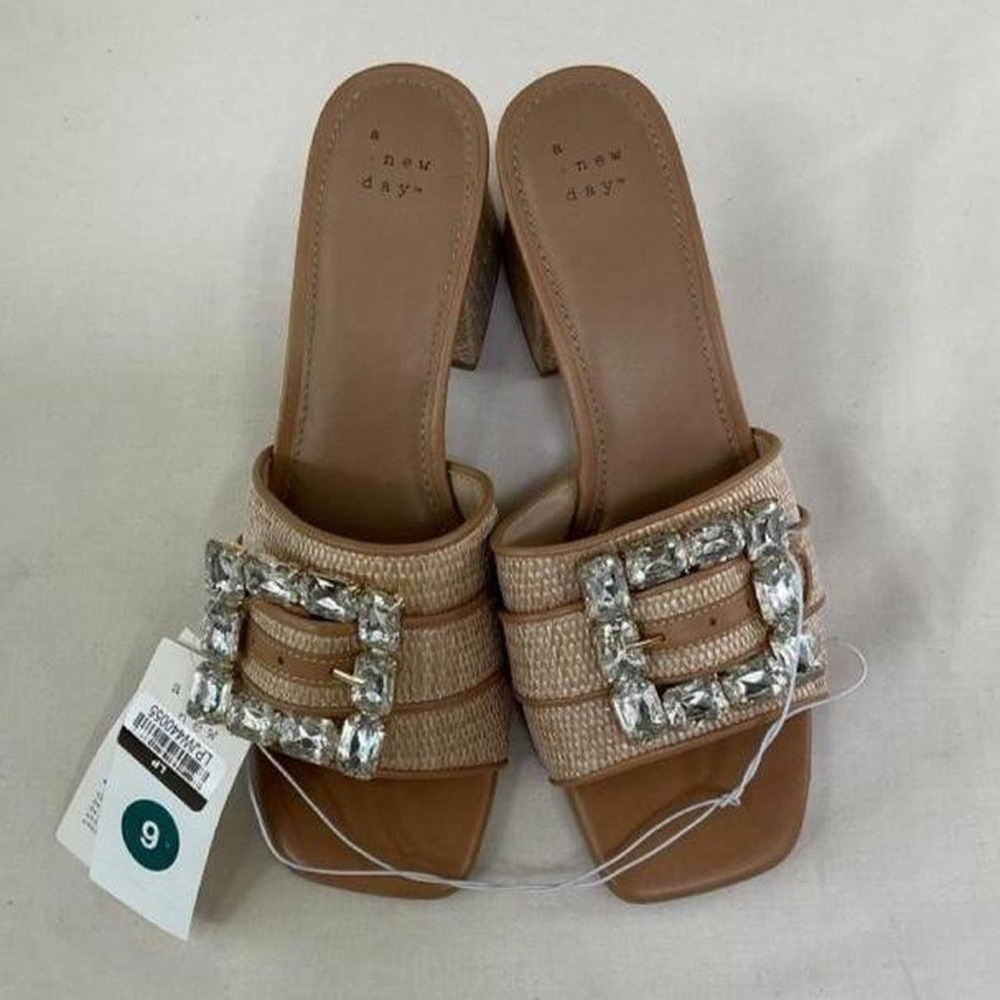 A New Day mule heels featuring a stunning oversized rhinestone buckle